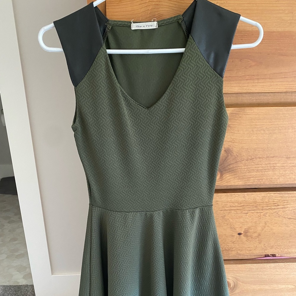 Green A-line mini dress with leather shoulder pads